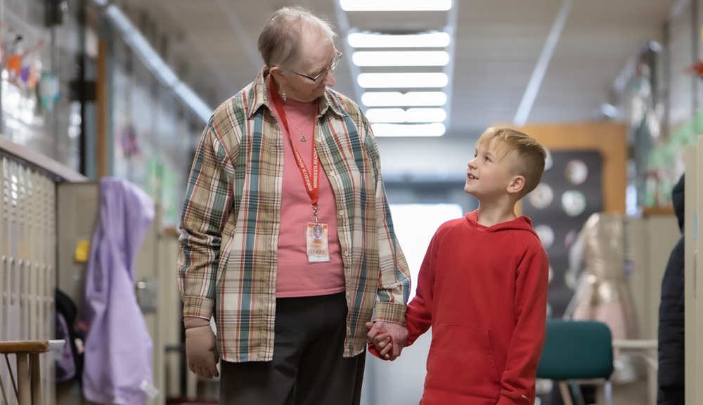 foster grandparent volunteer with student