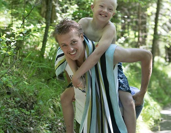 Counselor and camper piggyback
