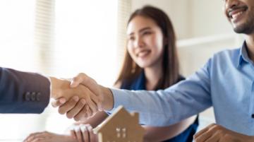 Men shaking hands after finalizing home purchase