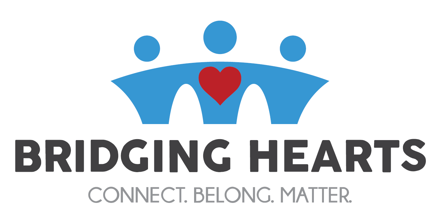 Bridging Hearts logo, graphic of 3 people resembling a bridge with red heart in center