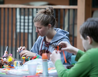 Campers working hard on crafts.