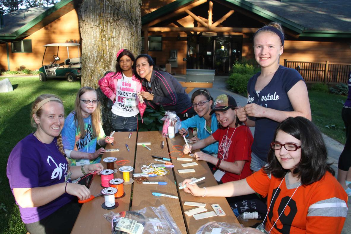 Campers enjoying arts and crafts.