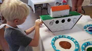 Child painting an ark