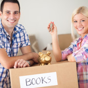 Couple leaning on moving box