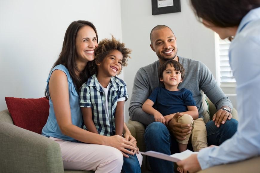 Multiracial family talking with financial advisor