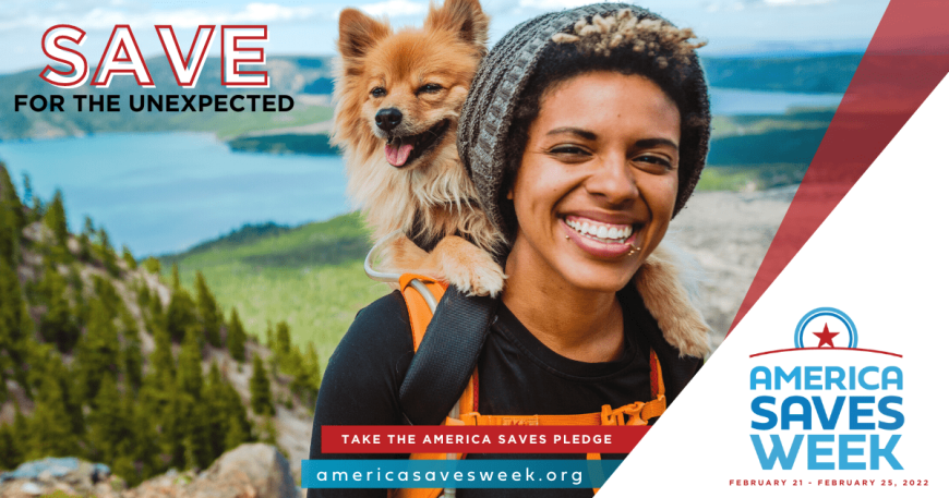 African American individual smiling with dog on their back