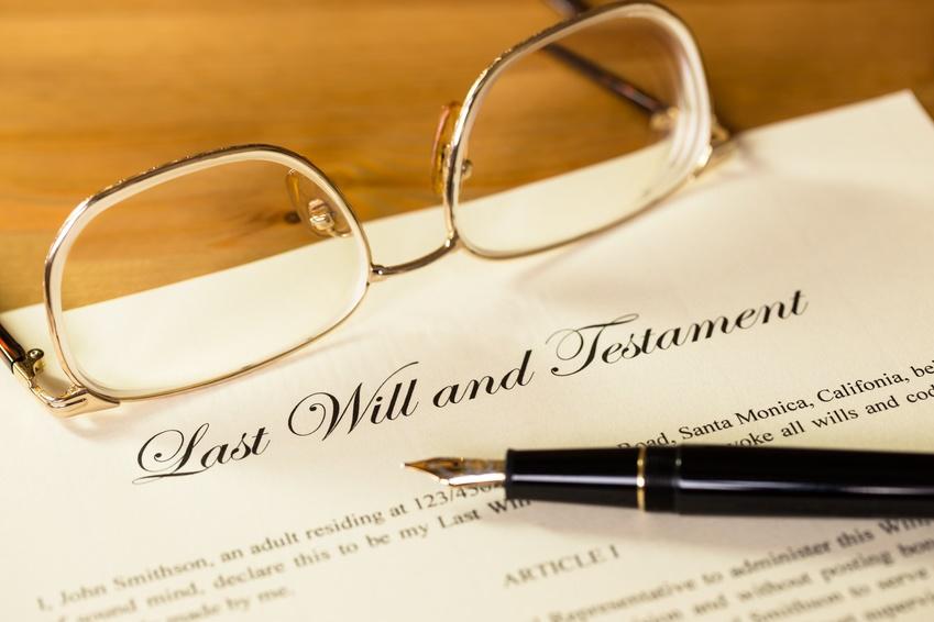 Eye glasses and pen on top of document that is titled, "Last Will and Testament"