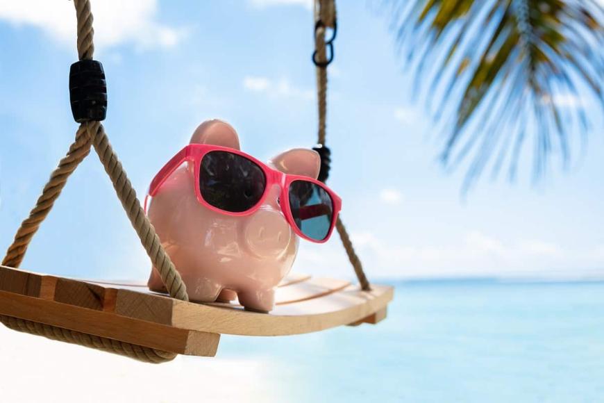 piggy bank with on the beach