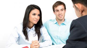 Multiracial couple meeting with financial advisor