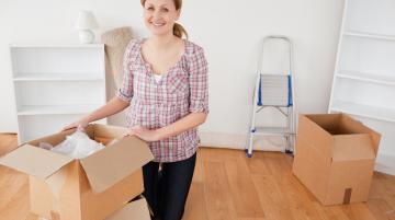 Woman unpacking boxes