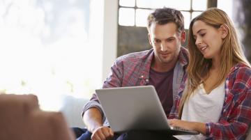 Young couple on laptop 