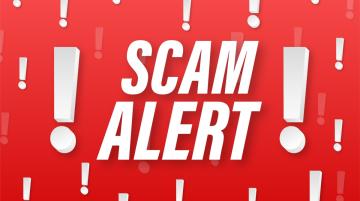 The words "Scam Alert" surrounded by exclamation points on a red background