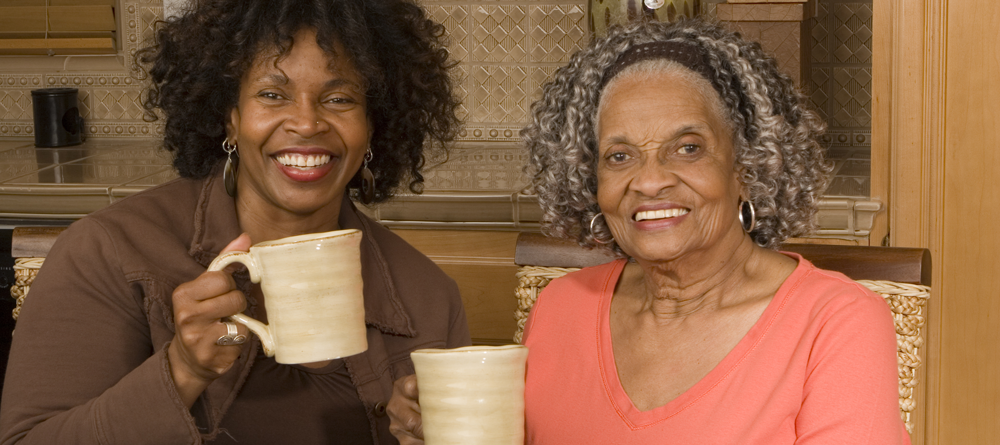 Two women drinking coffee together