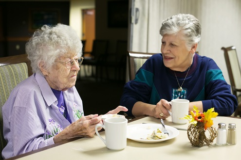 Elderly women dining.