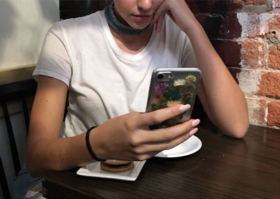 Teen holding a cellphone