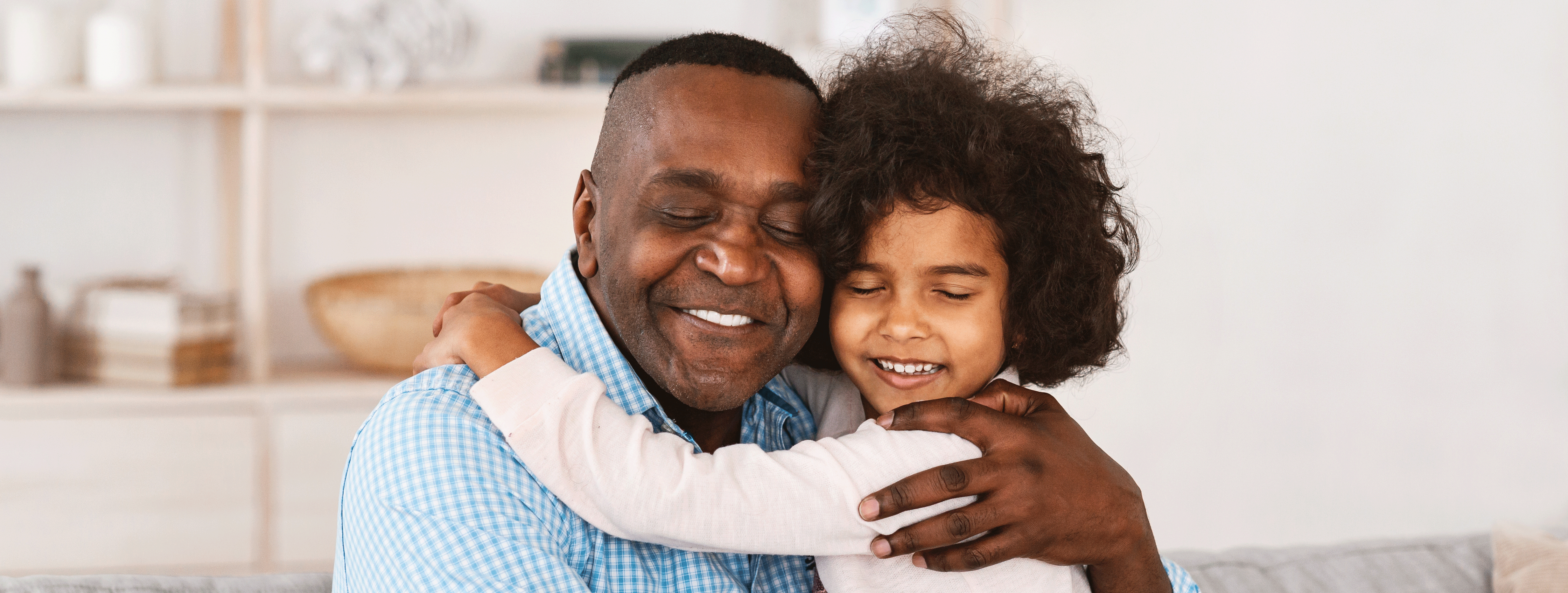 Older adult and child embracing