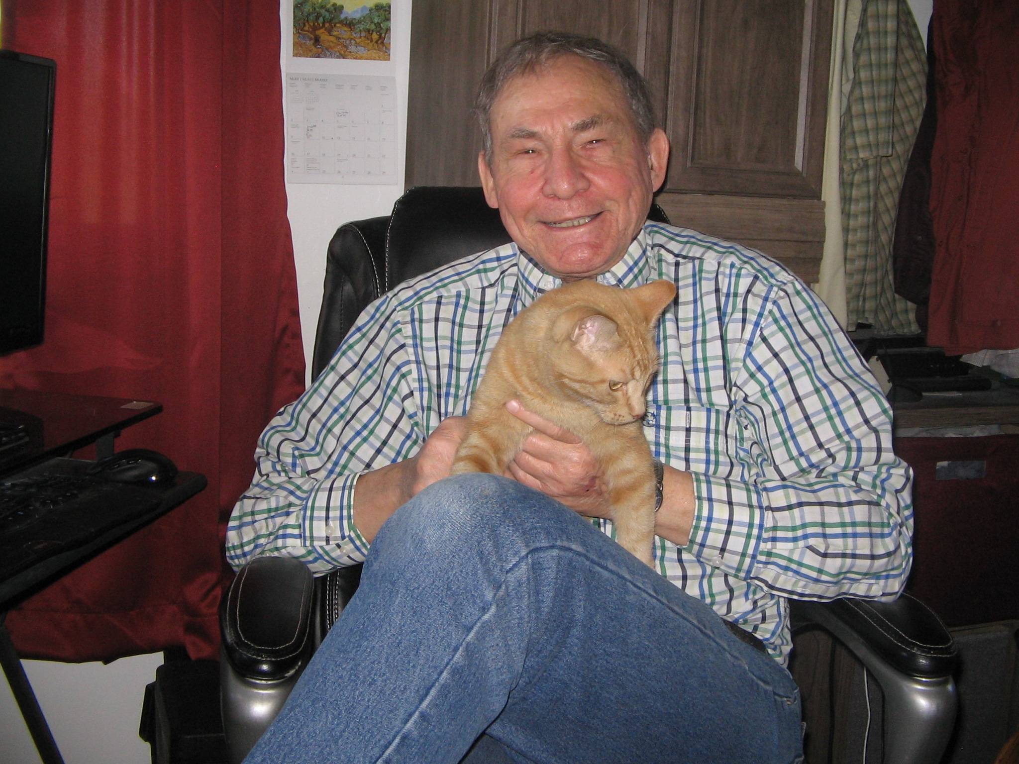 Erwin Rud holding his cat named Vicky Cat