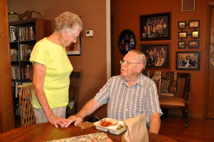 Older adult receiving a home delivered meal.