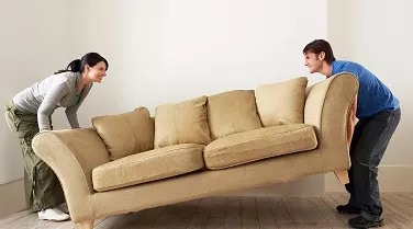 Couple moving couch.